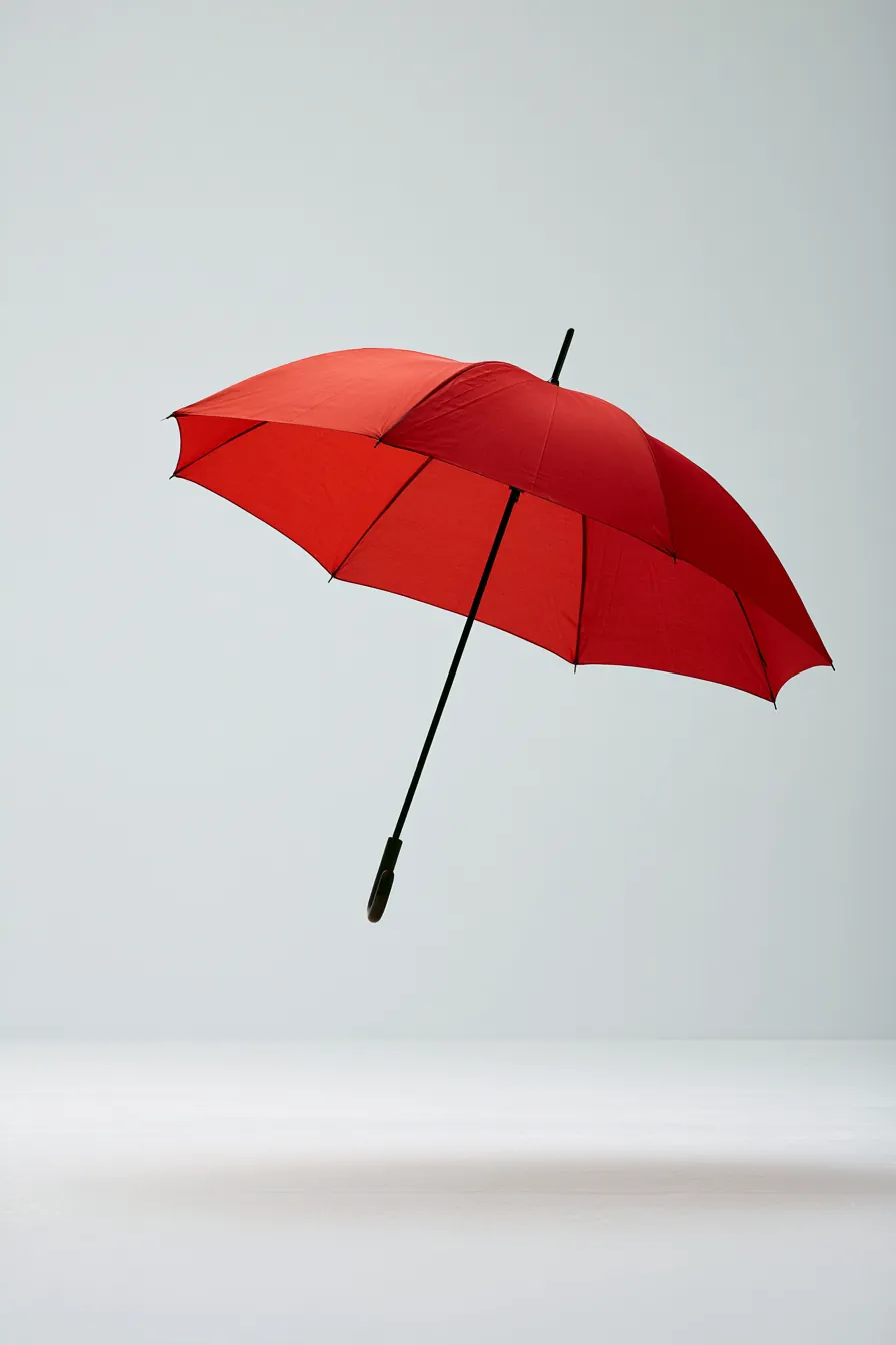 Single red umbrella standing open, a symbol of short-term financial cover